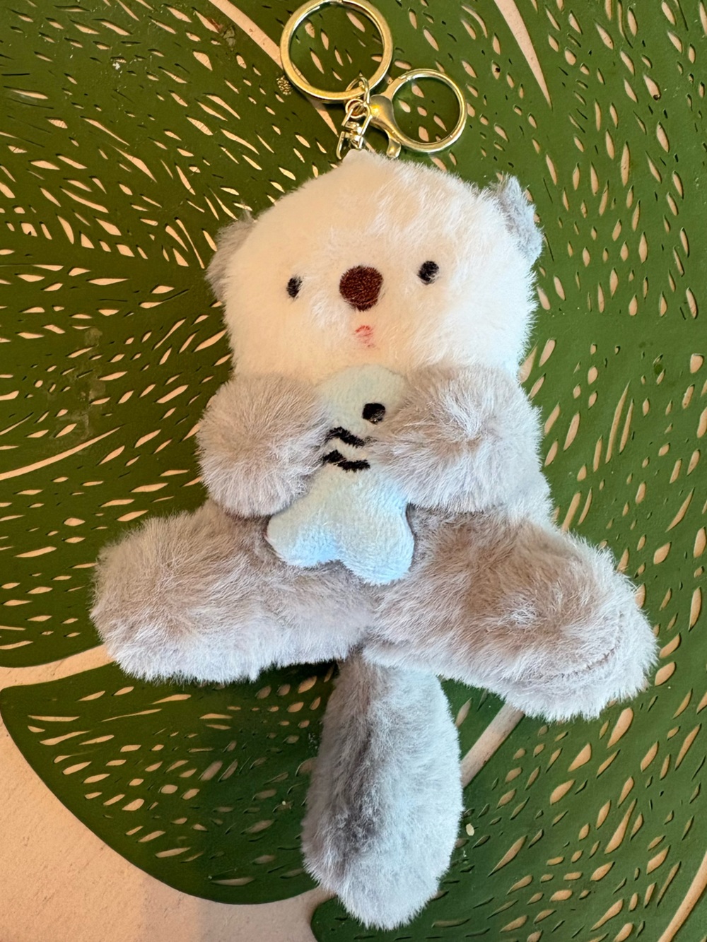 Plush Grey and Cream Otter Holding Blue Fish key chain